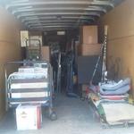 inside of 20 foot enclosed trailer almost full of boxes and other equipment to move to another house.